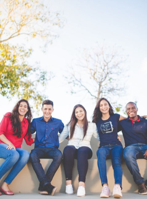 five happy people sitting
